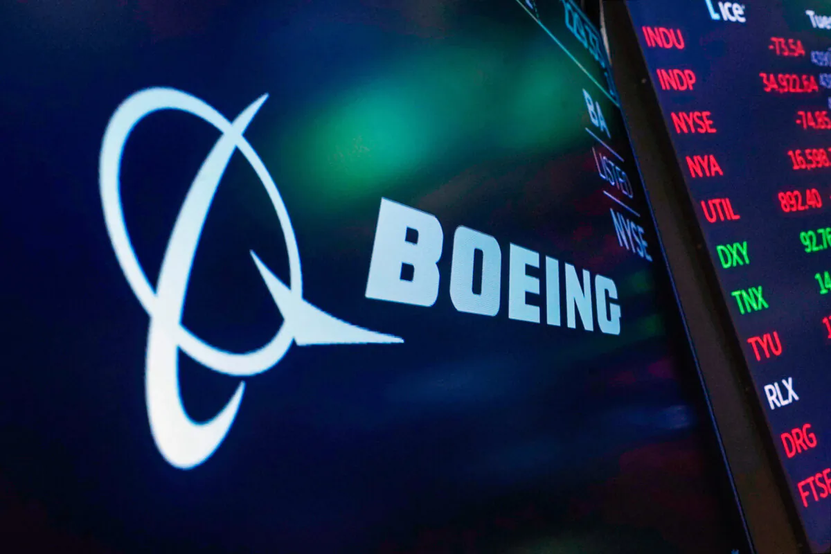 The logo for Boeing on a screen above a trading post on the floor of the New York Stock Exchange in New York City on July 13, 2021. (Richard Drew/AP)