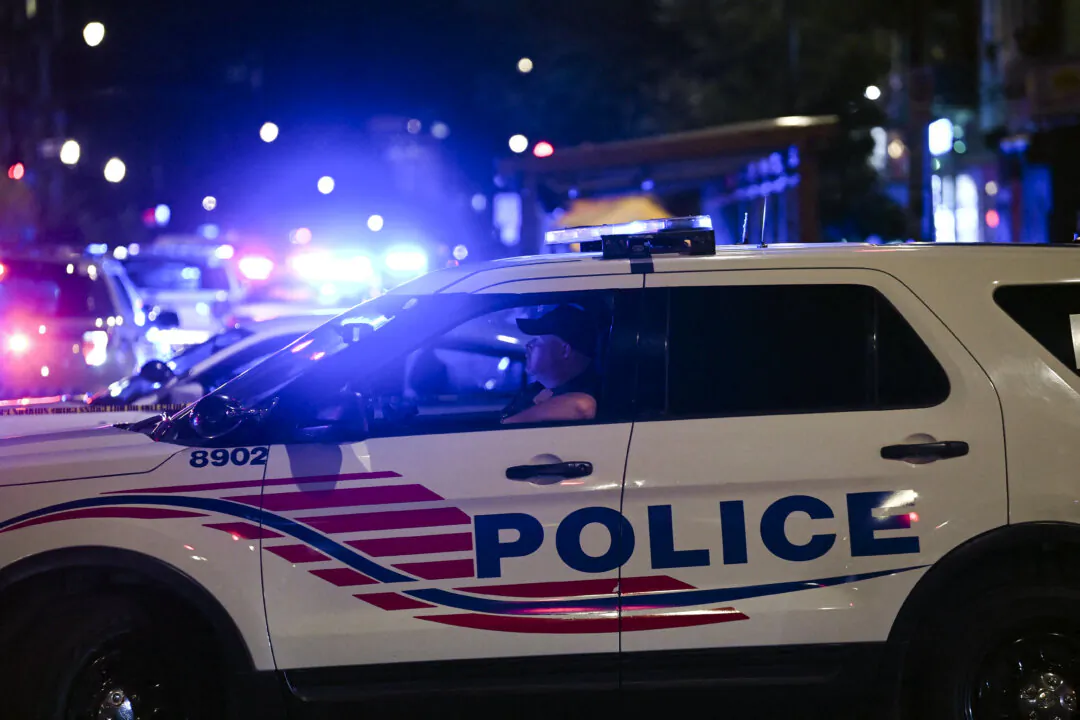 Police cars block a street in Washington on July 22, 2021. (Brendan Smialowski/AFP via Getty Images)