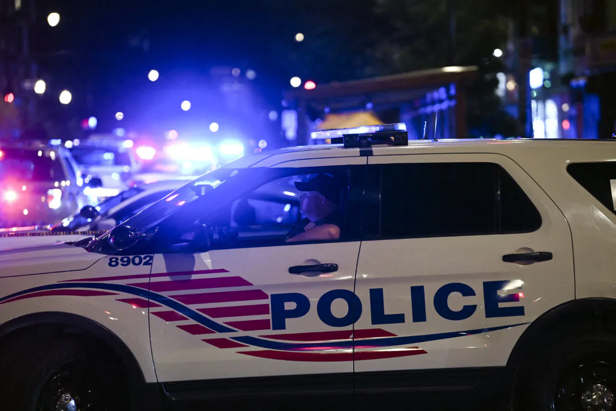 Police cars block a street in Washington on July 22, 2021. (Brendan Smialowski/AFP via Getty Images)