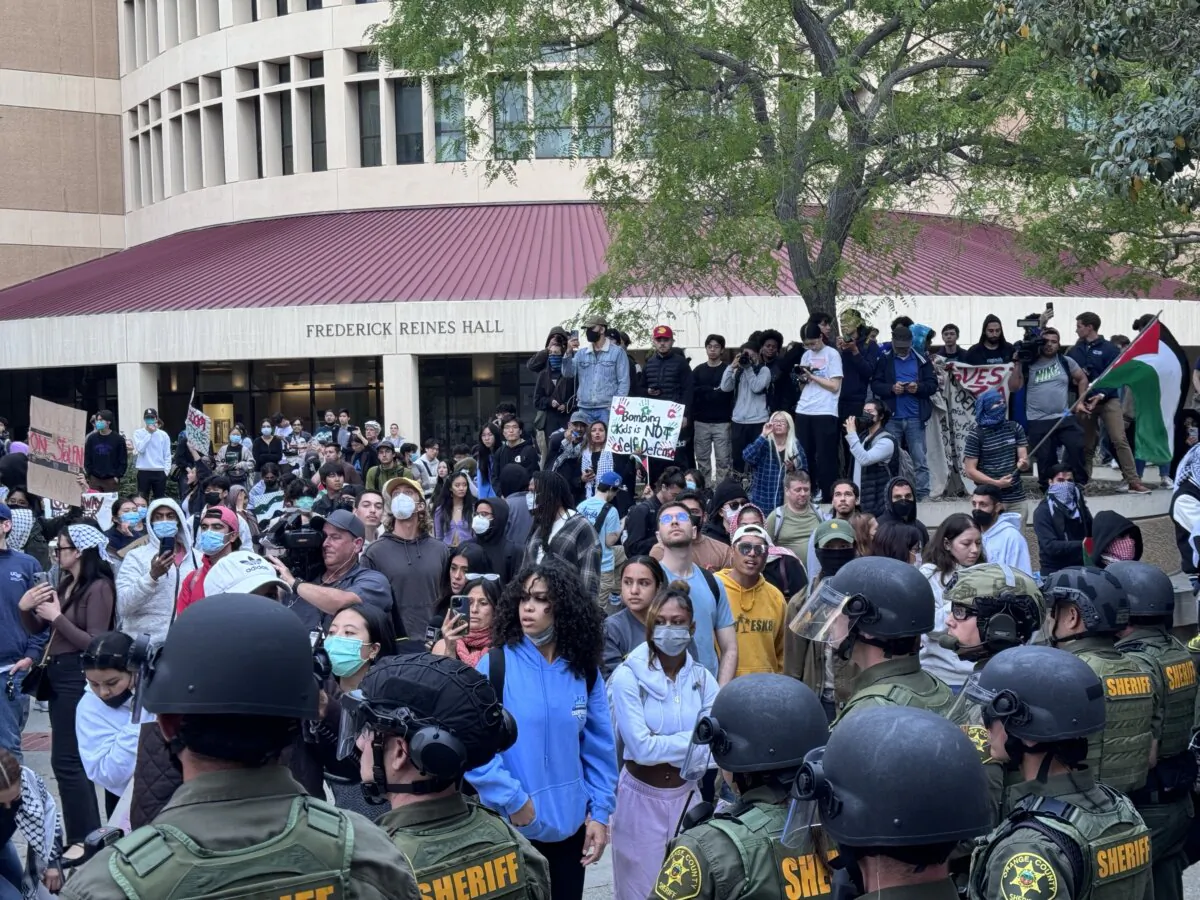 Police move to break up a pro-Palestinian protest at the University of California–Irvine in Irvine, Calif., on May 15, 2024. (Rudy Blalock/The Epoch Times)