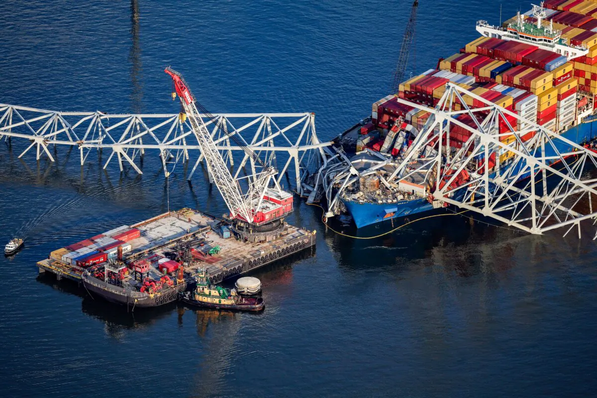 In an aerial view, salvage crews continue to remove wreckage from the cargo ship Dali after it stuck and collapsed the Francis Scott Key Bridge in the Baltimore Harbor, Md., on April 9, 2024. (Kevin Dietsch/Getty Images)