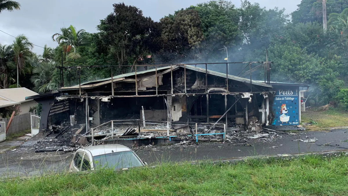 A damaged building is seen as rioters protest against plans to allow more people to take part in local elections in the French-ruled territory, which indigenous Kanak protesters reject, in Noumea, New Caledonia, May 15, 2024, in this picture obtained from social media. Lilou Garrido Navarro Kherachi/via REUTERS