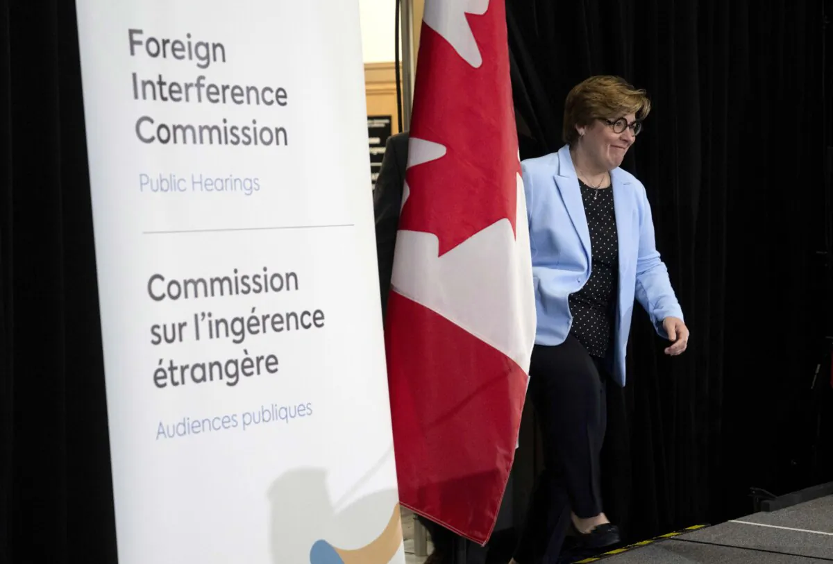 Commissioner Justice Marie-Josee Hogue makes her way on stage to deliver remarks on the interim report following its release at the Public Inquiry Into Foreign Interference in Federal Electoral Processes and Democratic Institutions, in Ottawa on May 3, 2024. (The Canadian Press/Adrian Wyld)