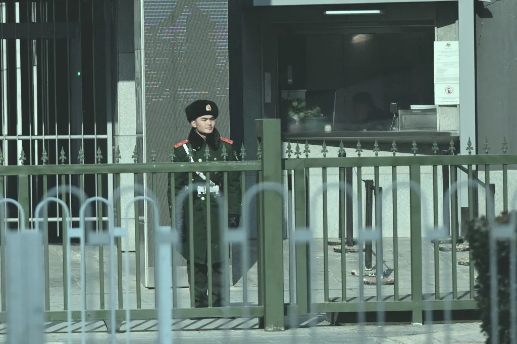 A Chinese paramilitary police officer stands guard outside the Australian Embassy in Beijing on Feb. 5, 2024. (Pedro Pardo/AFP)