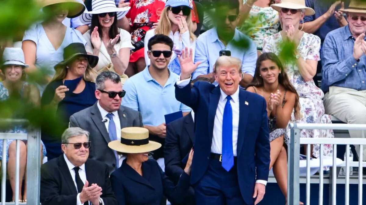 Former President Donald Trump waves as he attends the graduation ceremony of his son, Barron Trump, at Oxbridge Academy in Palm Beach, Fla., on May 17, 2024. (Giorgio Viera/AFP via Getty Images)