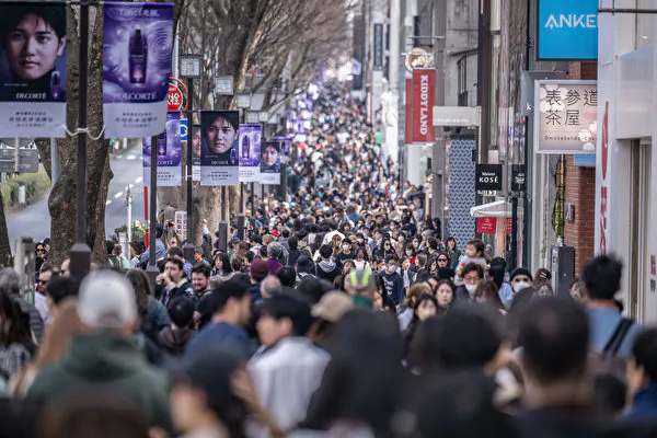 People walk through Omotesando shopping street in Tokyo on March 17, 2024. (Yuichi Yamazaki/ AFP)