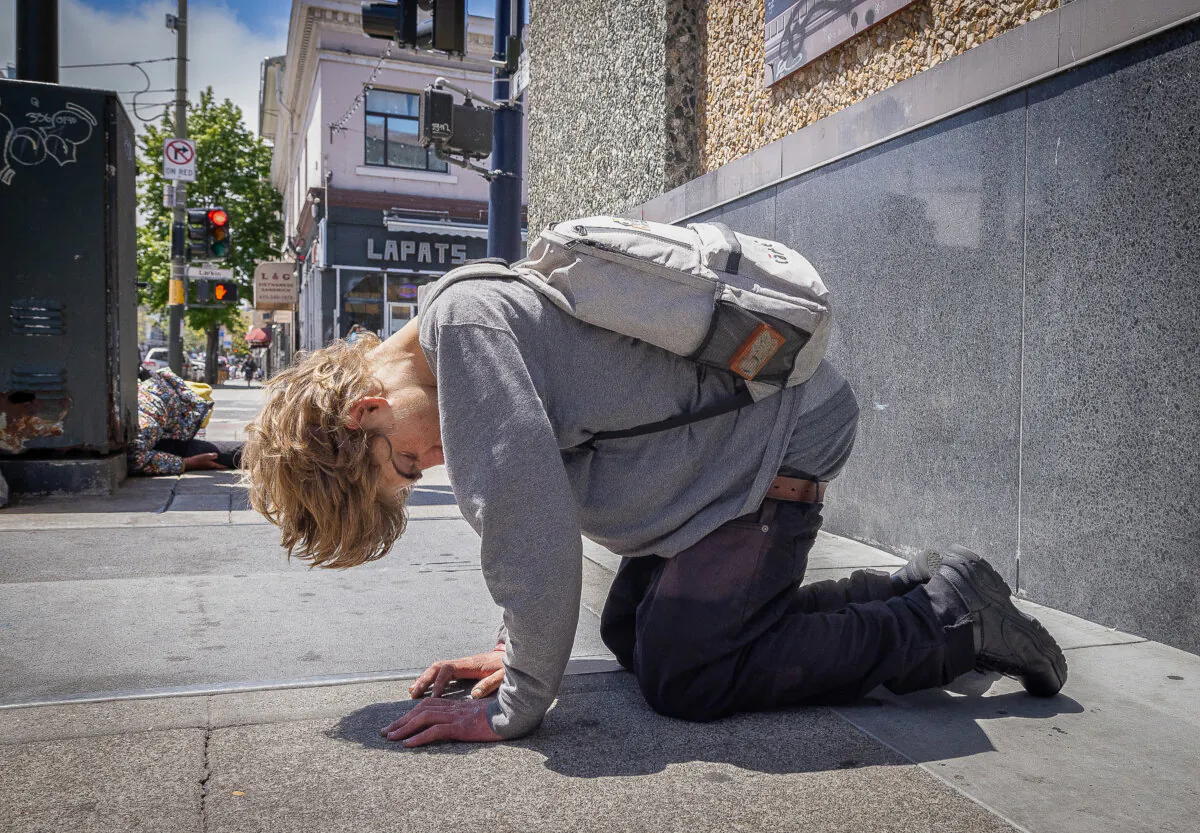 A person under the influence of drugs in the Tenderloin District of San Francisco, Calif., on May 16, 2024. (John Fredricks/The Epoch Times)