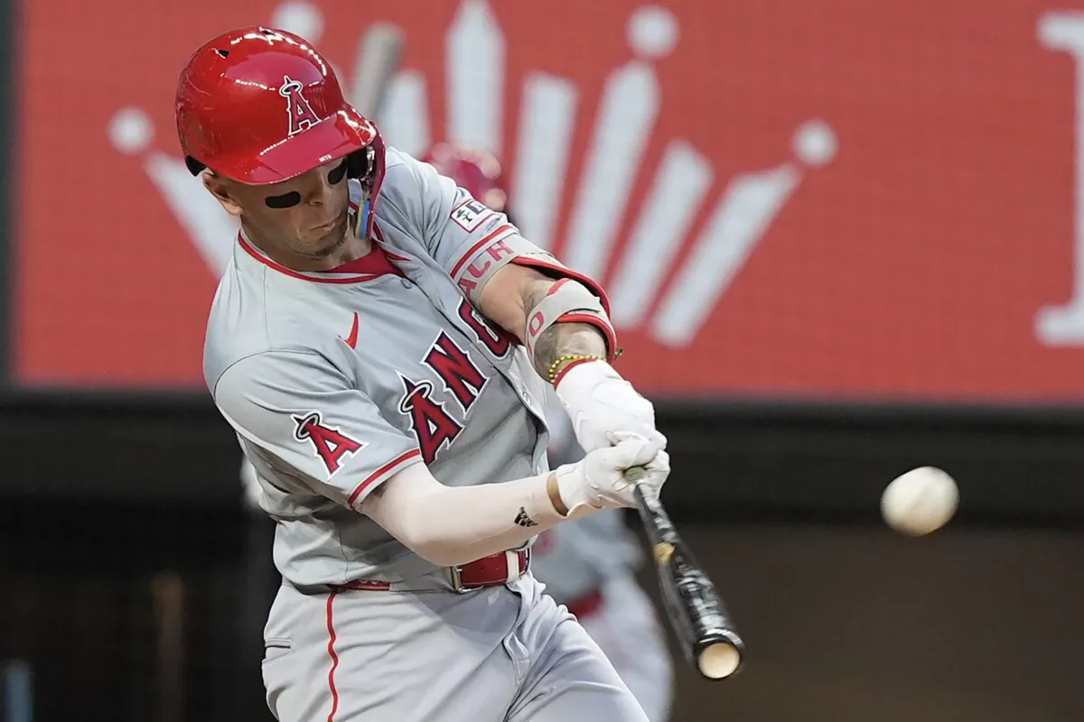 Los Angeles Angels' Zach Neto hits a home run that also scored teammate Jo Adell during the fourth inning of a baseball game against the Texas Rangers in Arlington, Texas, on May 17, 2024. (LM Otero/AP Photo)