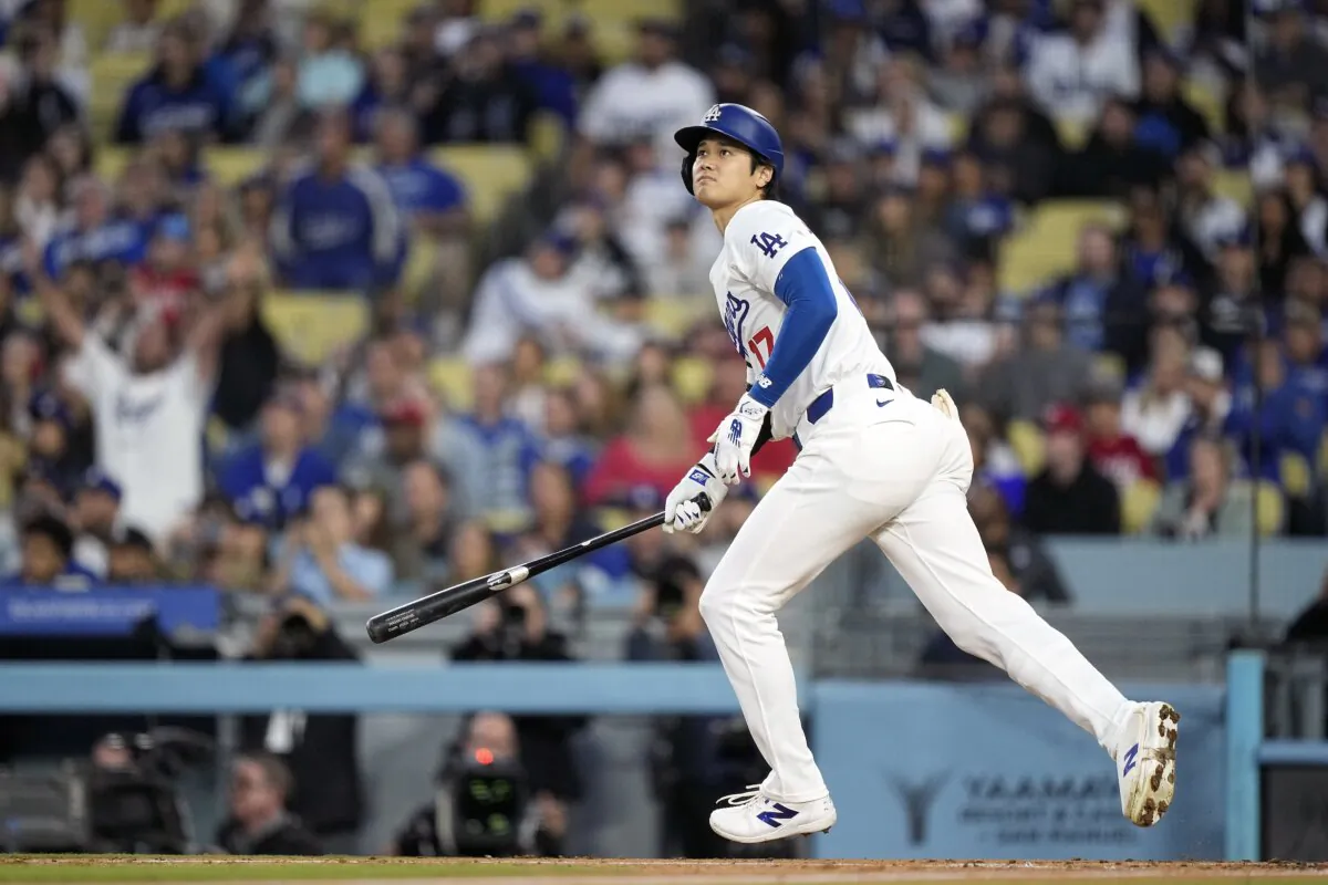 Los Angeles Dodgers designated hitter Shohei Ohtani heads to first after hitting a two-run home run during the third inning of a baseball game against the Cincinnati Reds in Los Angeles on May 17, 2024. (Mark J. Terrill/AP Photo)