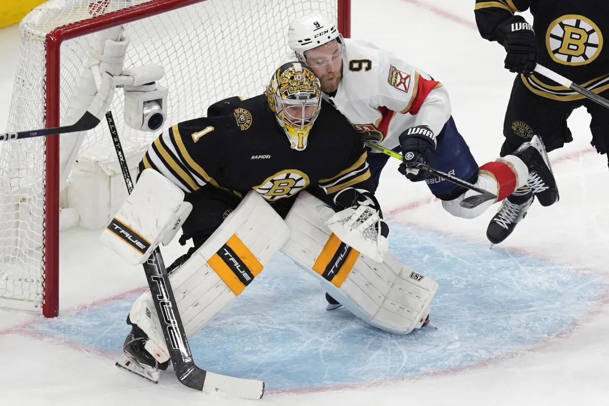 Florida Panthers' Sam Bennett (9) collides with Boston Bruins' Jeremy Swayman (1) during the first period in Game 6 of an NHL hockey Stanley Cup second-round playoff series in Boston on May 17, 2024. (Michael Dwyer/AP Photo)