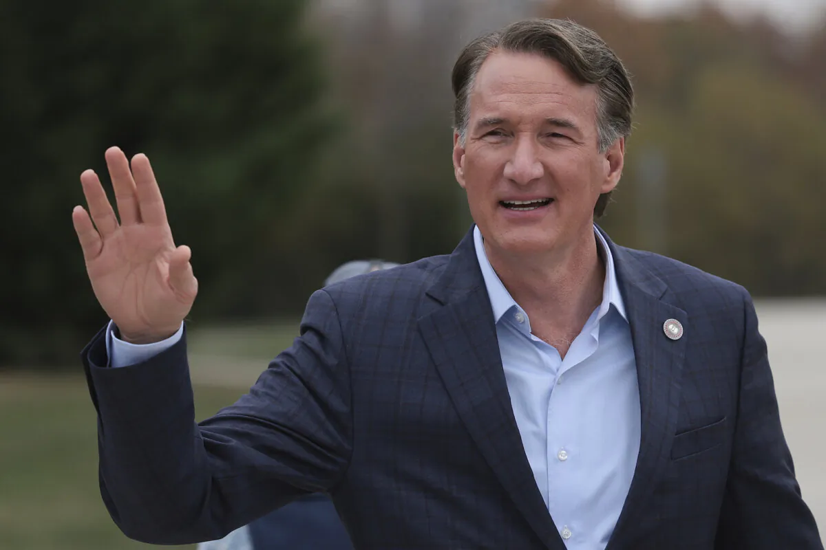 Virginia Governor Glenn Youngkin gestures to supporters while arriving at Piney Branch Elementary School in Bristow, Va., on Nov. 7, 2023. (Win McNamee/Getty Images)