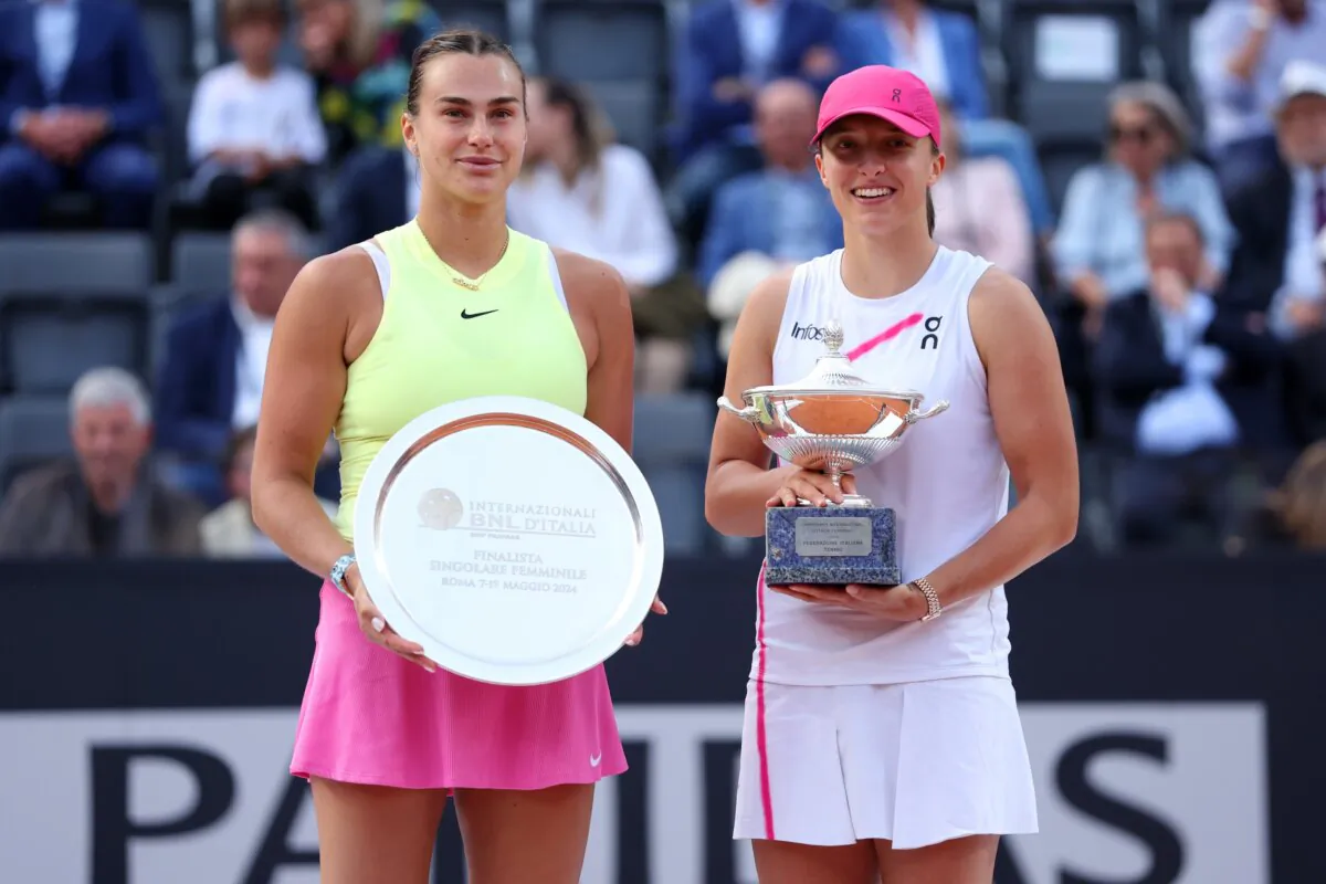 Iga Swiatek of Poland poses with the Internazionali BNL D'Italia trophy next to runner-up Aryna Sabalenka  after their Women's Singles Final Match o during Day 13 of the Internazionali BNL D'Italia 2024 in Rome on May 18, 2024. (Dan Istitene/Getty Images)