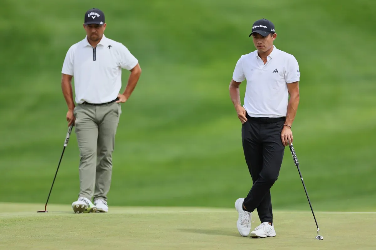 Xander Schauffele of the United States and Collin Morikawa of the United States prepare to putt on the fifth green during the third round of the 2024 PGA Championship at Valhalla Golf Club in Louisville on May 18, 2024. (Andy Lyons/Getty Images)