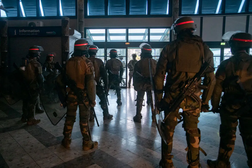 French soldiers of the 8th Marine Infantry Regiment (8e RIMa) secure the Magenta airport in Noumea, France's Pacific territory of New Caledonia, on May 17, 2024. France deployed troops to New Caledonia's ports and international airport, banned TikTok and imposed a state of emergency on May 16 after three nights of clashes that have left four dead and hundreds wounded. Pro-independence, largely indigenous protests against a French plan to impose new voting rules on its Pacific archipelago have spiralled into the deadliest violence since the 1980s, with a police officer among several killed by gunfire. (Photo by Delphine Mayeur / AFP) (Photo by DELPHINE MAYEUR/AFP via Getty Images)