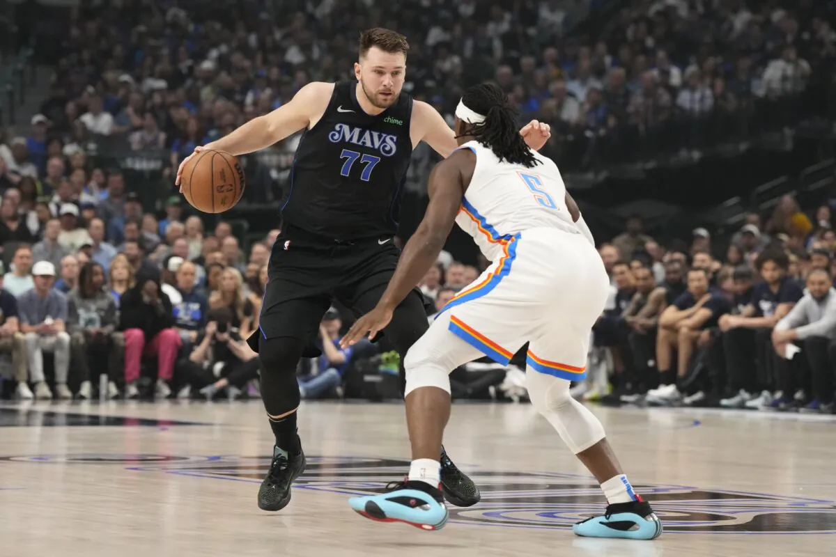 Luka Doncic (77) of the Dallas Mavericks dribbles against Luguentz Dort (5) of the Oklahoma City Thunder during the first quarter in Game Six of the Western Conference Second Round Playoffs in Dallas on May 18, 2024. (Sam Hodde/Getty Images)