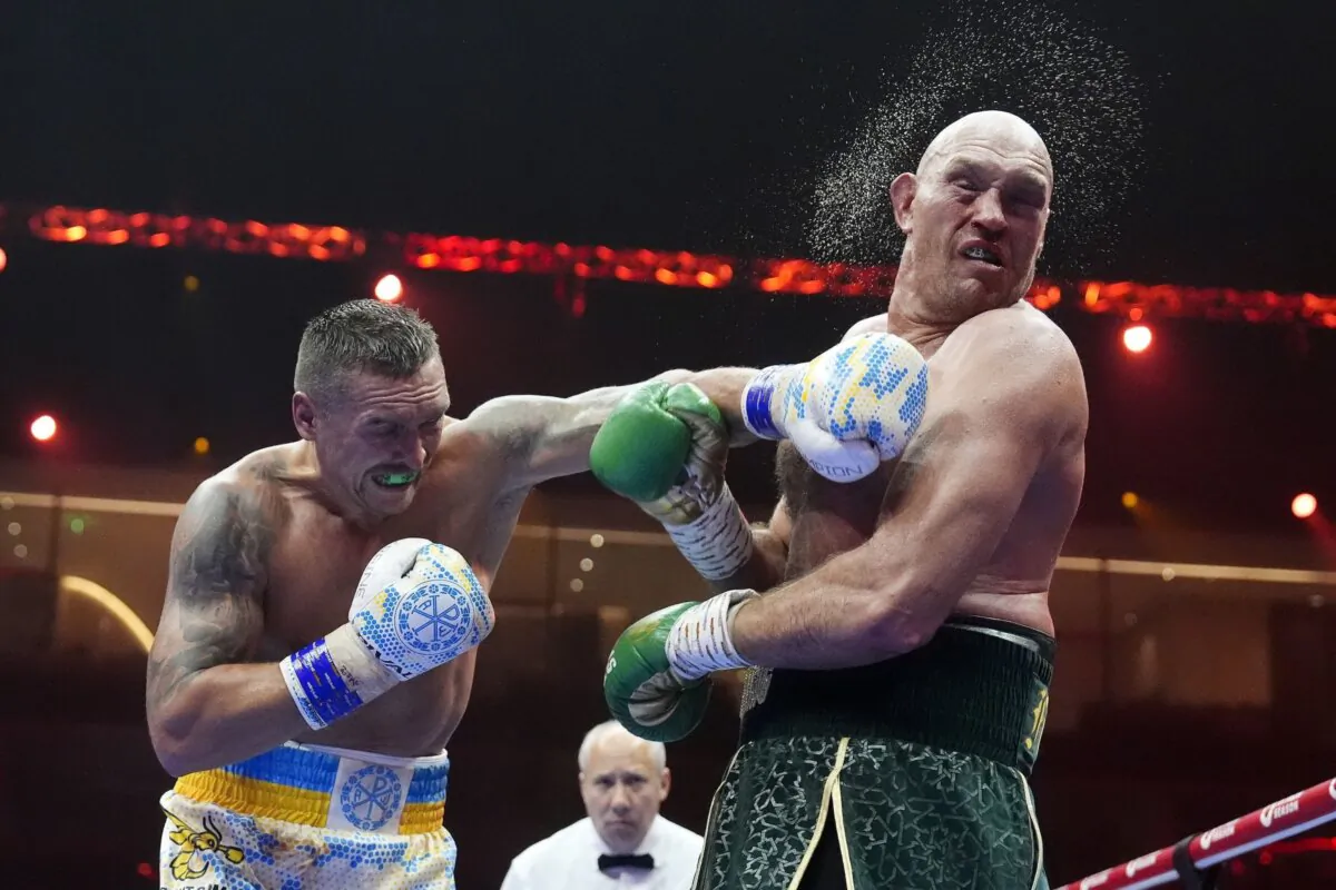 Britain’s Tyson Fury(R) takes a blow from Ukraine’s Oleksandr Usyk during their undisputed heavyweight world championship boxing fight in Riyadh, Saudi Arabia on May 19, 2024. (Nick Potts/PA via AP)