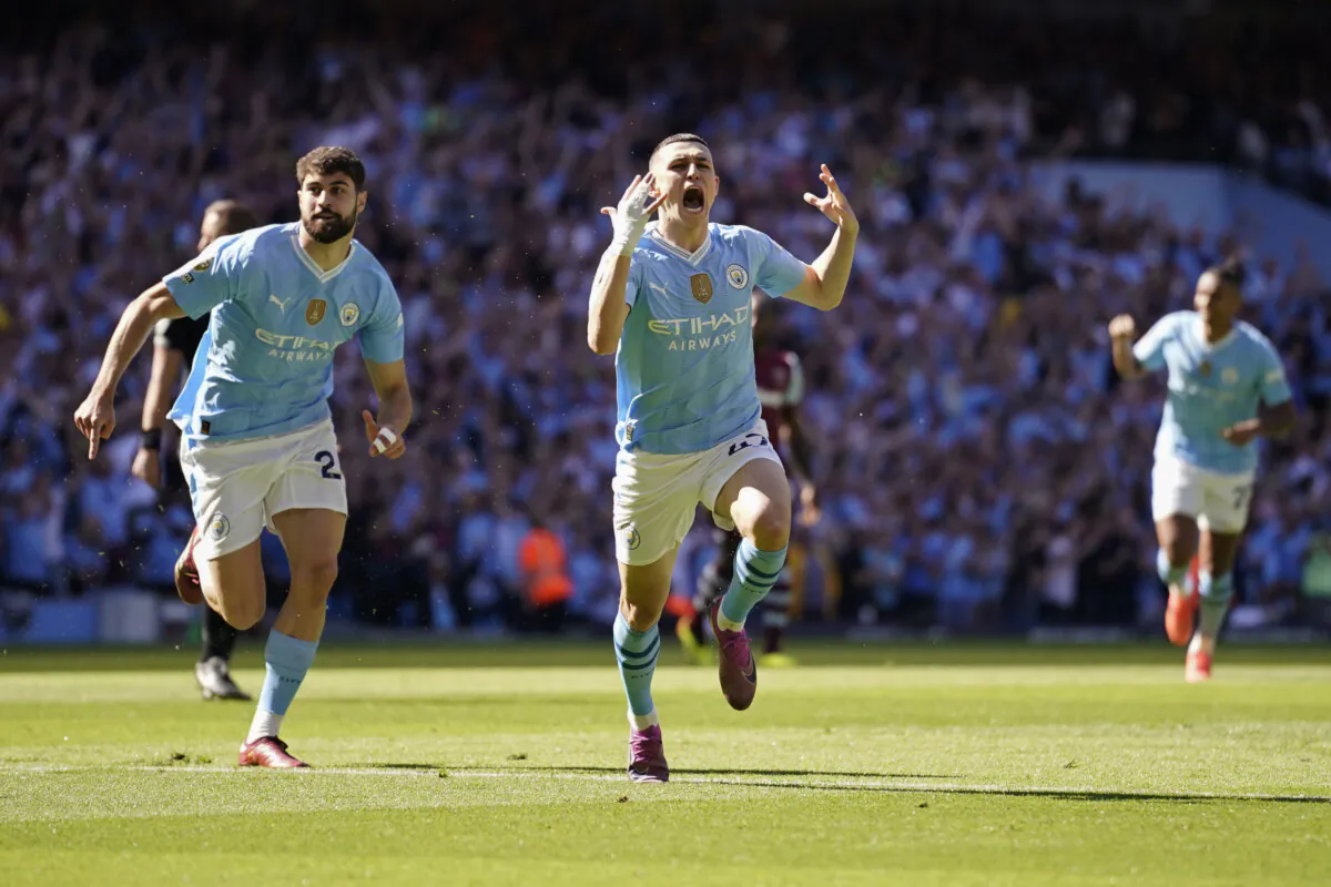 Manchester City's Phil Foden (C) celebrates after scoring his side's opening goal during the English Premier League soccer match between Manchester City and West Ham United at the Etihad Stadium in Manchester, England, on May 19, 2024. (Dave Thompson/AP Photo)