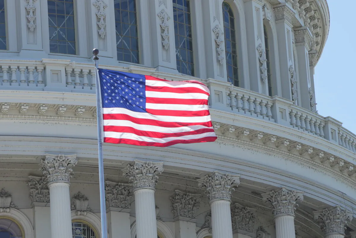 A U.S. flag flies at the U.S. Capitol in Washington on May 13, 2024. (Lei Chen/NTD)