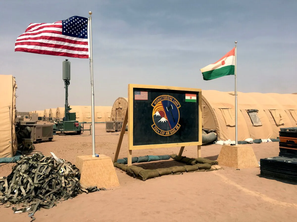 Flags of the United States and Niger are flown side by side at the base camp for personnel supporting the construction of Niger Air Base 201 in Agadez, Niger, on April 16, 2018. (Carley Petesch/AP Photo)