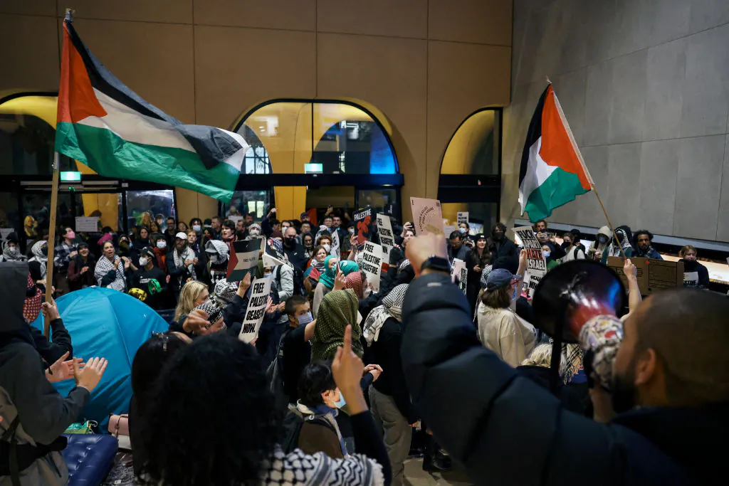 Pro-Palestinian students hold a sit-in in Melbourne on May 15, 2024 at Melbourne University's Arts West building, which the students have temporarily renamed as "Mahmoud's Hall" after Mahmoud Al Haq, a prospective University of Melbourne student, who died in Gaza. (Martin Keep/AFP via Getty Images)