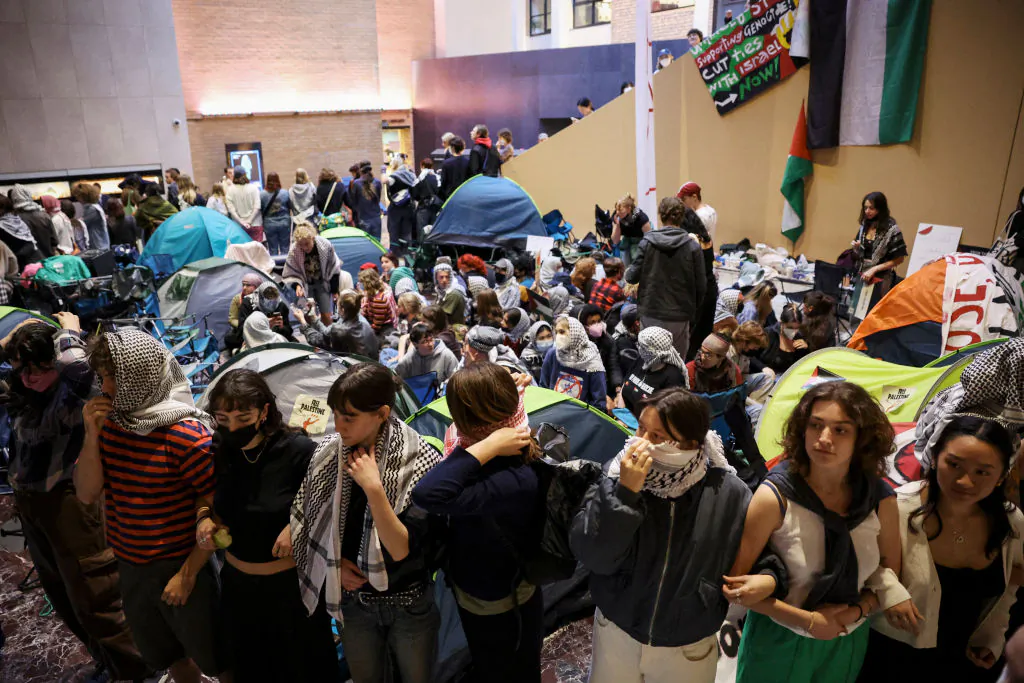 TOPSHOT - Pro-Palestinian students hold a sit-in in Melbourne, Australia on May 15, 2024 at Melbourne University's Arts West building, which the students have temporarily renamed as "Mahmoud's Hall." (Martin Keep/AFP via Getty Images)