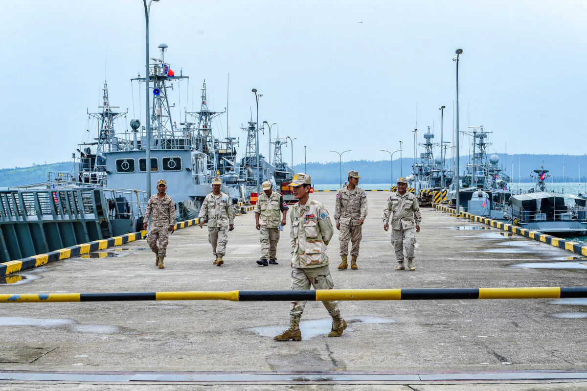 Members of the Cambodian navy walk on a jetty in Ream Naval Base, Cambodia, on July 26, 2019. (Tang Chhin Sothy/AFP via Getty Images)