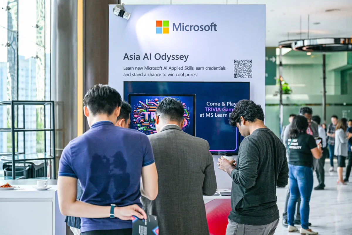 Participants check a Microsoft booth before CEO Satya Nadella's speech during an event named Microsoft Build AI Day in Kuala Lumpur on May 2, 2024. Microsoft on May 2, 2024 pledged a $2.2 billion investment in artificial intelligence and cloud computing in Malaysia to help develop the country's AI infrastructure, the tech giant said in a statement. (Photo by Mohd RASFAN / AFP) (Photo by MOHD RASFAN/AFP via Getty Images)