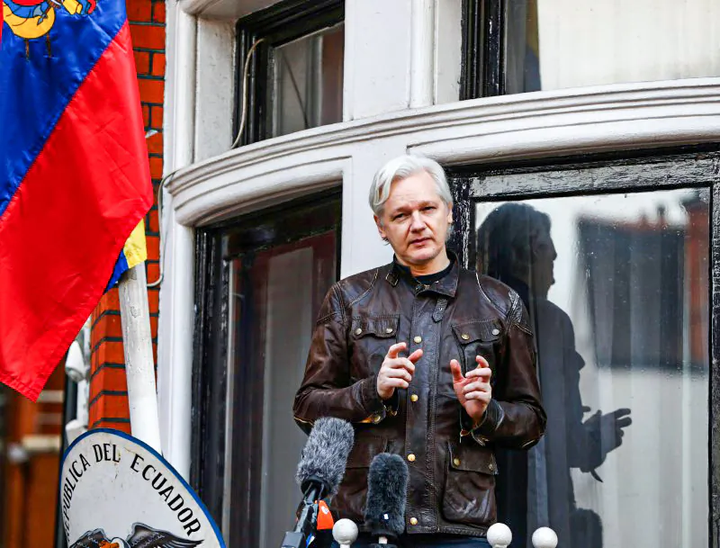 WikiLeaks founder Julian Assange speaks on the balcony of the Embassy of Ecuador in London, on May 19, 2017. (Neil Hall/Reuters)