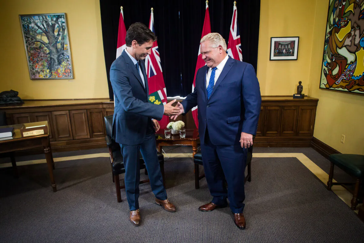 Prime Minister Justin Trudeau (L) and Ontario Premier Doug Ford pose for a photo at the Ontario legislature in Toronto on July 5, 2018. (The Canadian Press/Chris Young)