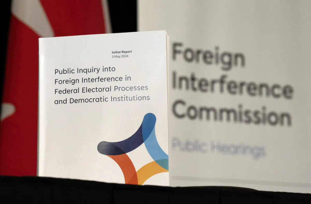 A copy of the interim report is seen on a table following its release by the Public Inquiry Into Foreign Interference in Federal Electoral Processes and Democratic Institutions, in Ottawa on May 3, 2024. (The Canadian Press/Adrian Wyld)