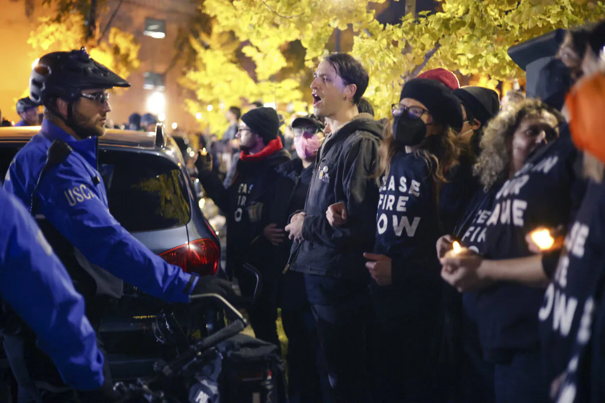 Members of U.S. Capitol Police and protesters stand off outside the headquarters of the Democratic National Committee during a demonstration against the war between Israel and Hamas on Capitol Hill in Washington on Nov. 15, 2023. (Alex Wong/Getty Images)