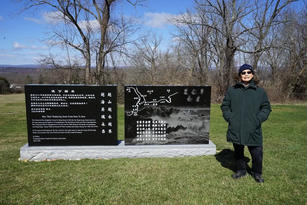 Lau Hin-ping stands in front of a monument commemorating youths who died while fleeing communist China during the Cultural Revolution was inaugurated at the Eternal Sunset Memorial Park in New Jersey in June 2022. (Jenny Zeng/The Epoch Times)