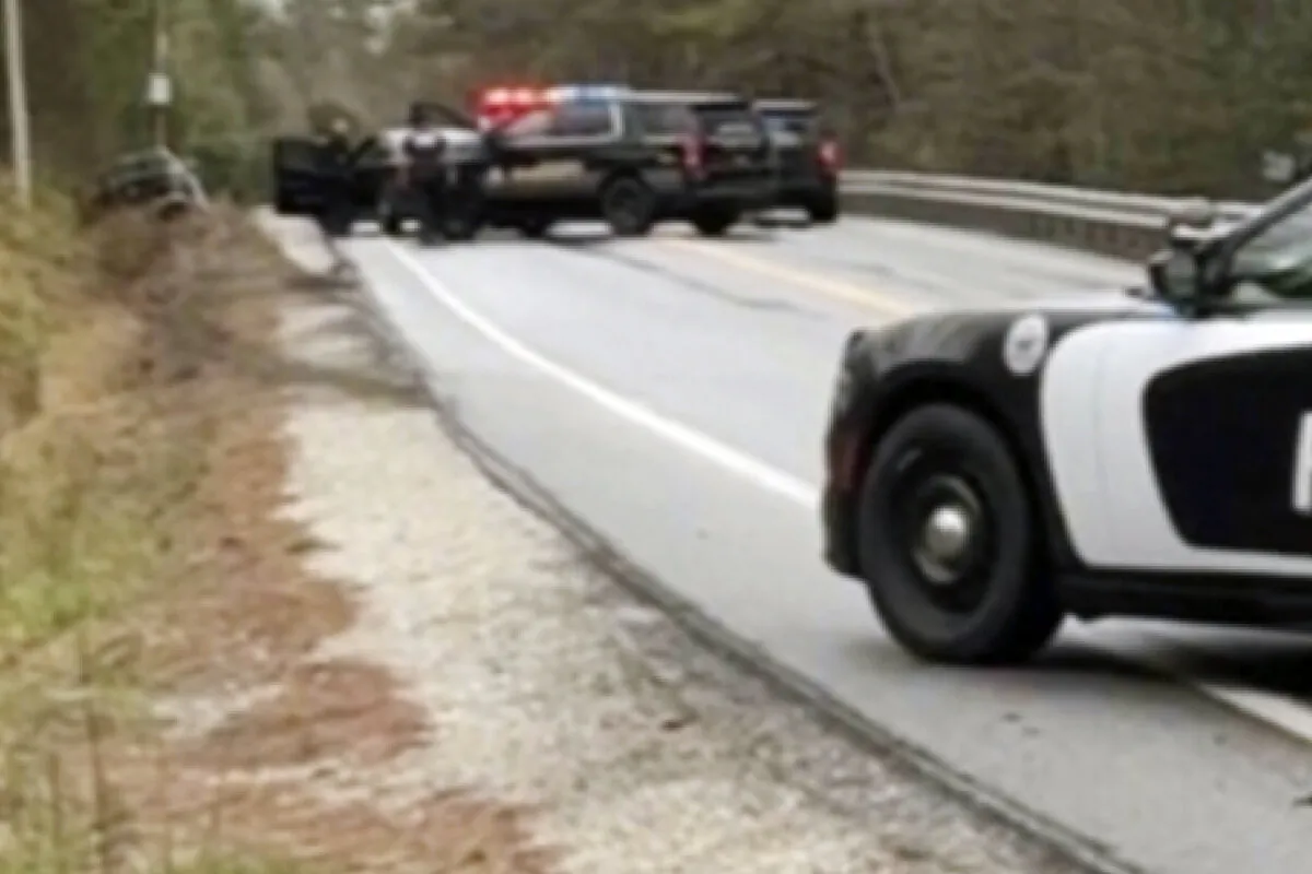 Law enforcement personnel converge on a suspect, who was arrested earlier in the day and then stole a police vehicle and crashing it, before exchanging gunfire with the suspect who then stole a second police vehicle, Monday, May 6, 2024, in Paris, Maine. (Linda Marie Mercer via AP, File)