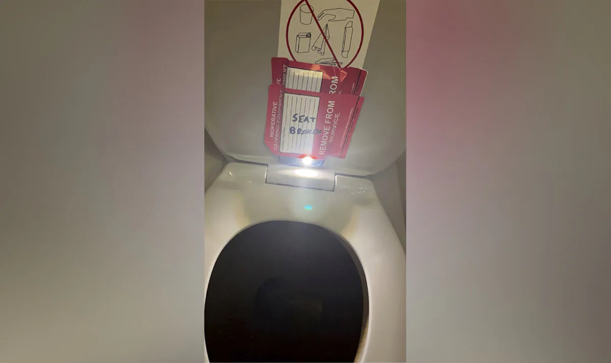 An iPhone is taped to the back of a toilet seat on an American Airlines flight from Charlotte, N.C., to Boston, on Sept. 2, 2023. (Lewis & Llewellyn LLP via AP, File)