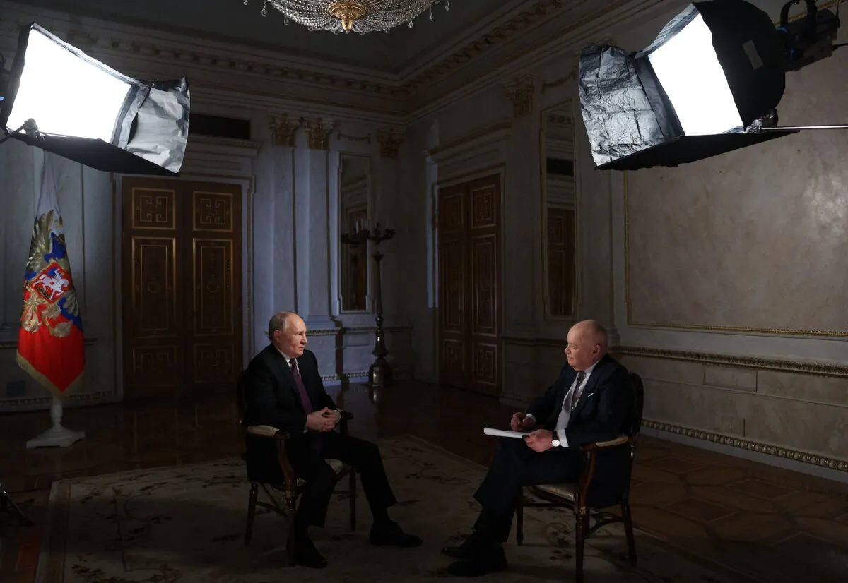 Russian President Vladimir Putin gives an interview to TV host and Director General of Rossiya Segodnya (RIA Novosti) news agency Dmitry Kiselyov at the Kremlin in Moscow on March 12, 2024. (Gavriil Grigorov/AFP via Getty Images)