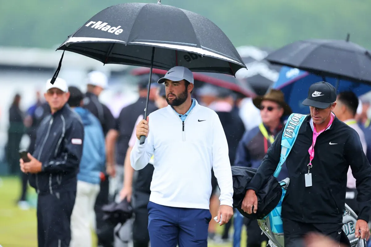 Scottie Scheffler and his caddie, Ted Scott, walk on the driving range during the second round of the 2024 PGA Championship at Valhalla Golf Club in Louisville, Kentucky, on May 17, 2024. (Michael Reaves/Getty Images)