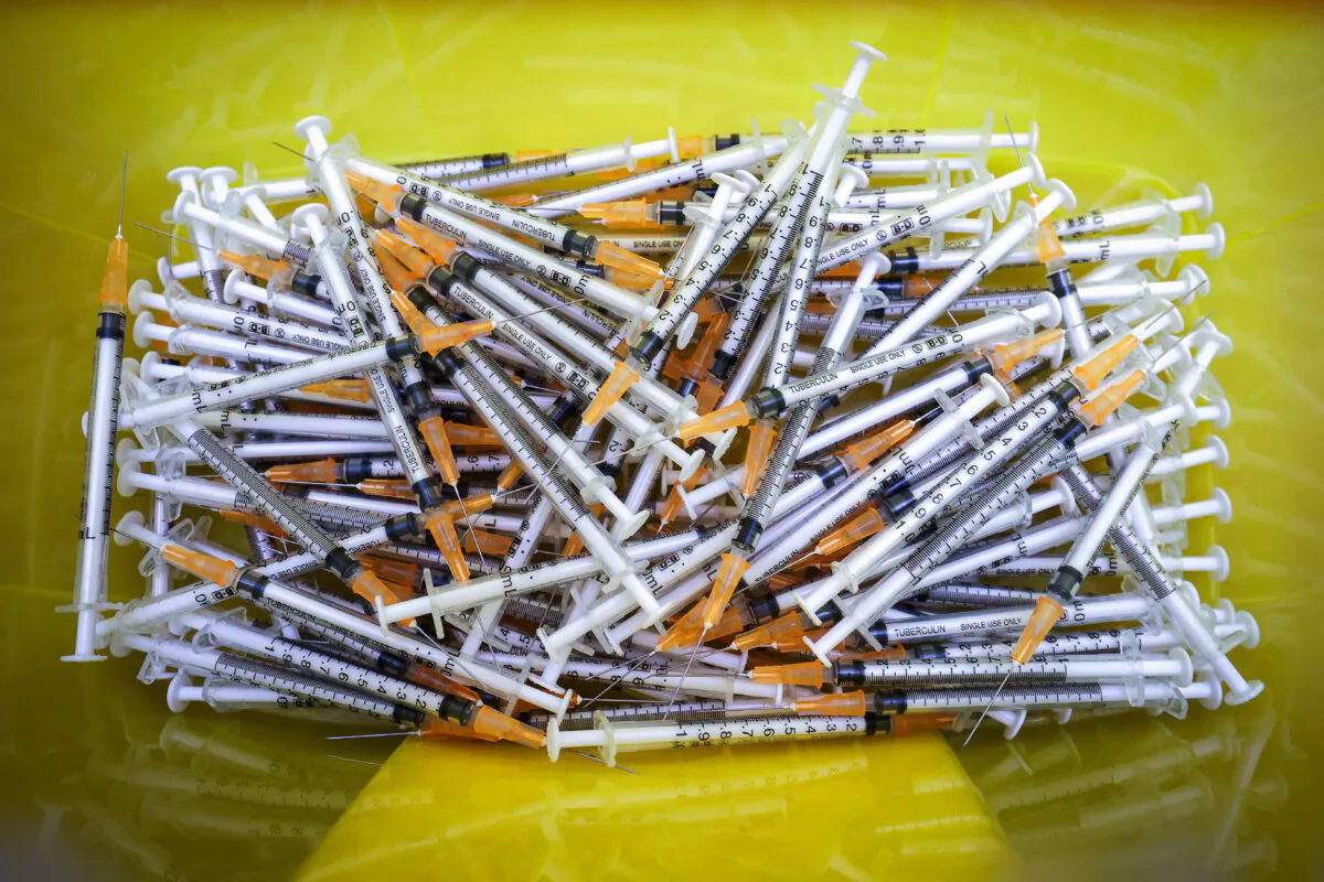 Needles from previous vaccine injections at a COVID-19 vaccine clinic in New Zealand in a file photograph. (Hagen Hopkins/Getty Images)