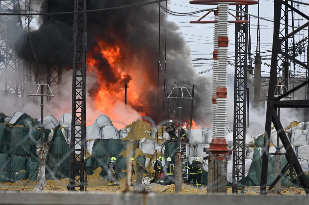 Firefighters extinguish a fire at an electrical substation after a missile attack in Kharkiv amid the Russian invasion in Ukraine, on March 22, 2024. (Sergey Bobok / AFP via Getty Images)