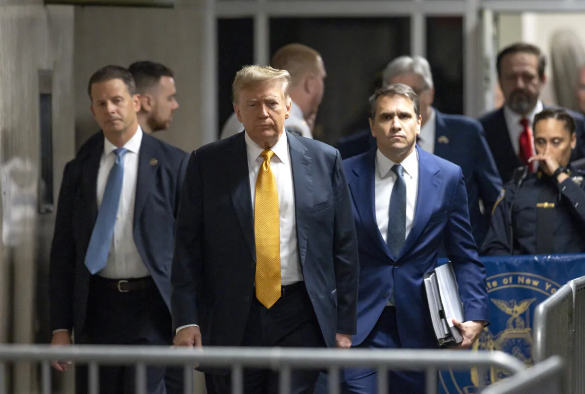 Former President Donald Trump speaks to members of the media before entering the courtroom with his attorney Todd Blanche (R) at Manhattan Criminal Court in New York City on May 21, 2024. (Justin Lane-Pool/Getty Images)