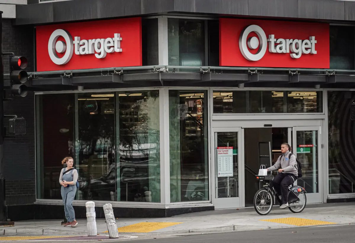 A cyclist rides by a Target store that is slated for closure in Oakland, Calif., on Sept. 29, 2023. (Justin Sullivan/Getty Images)