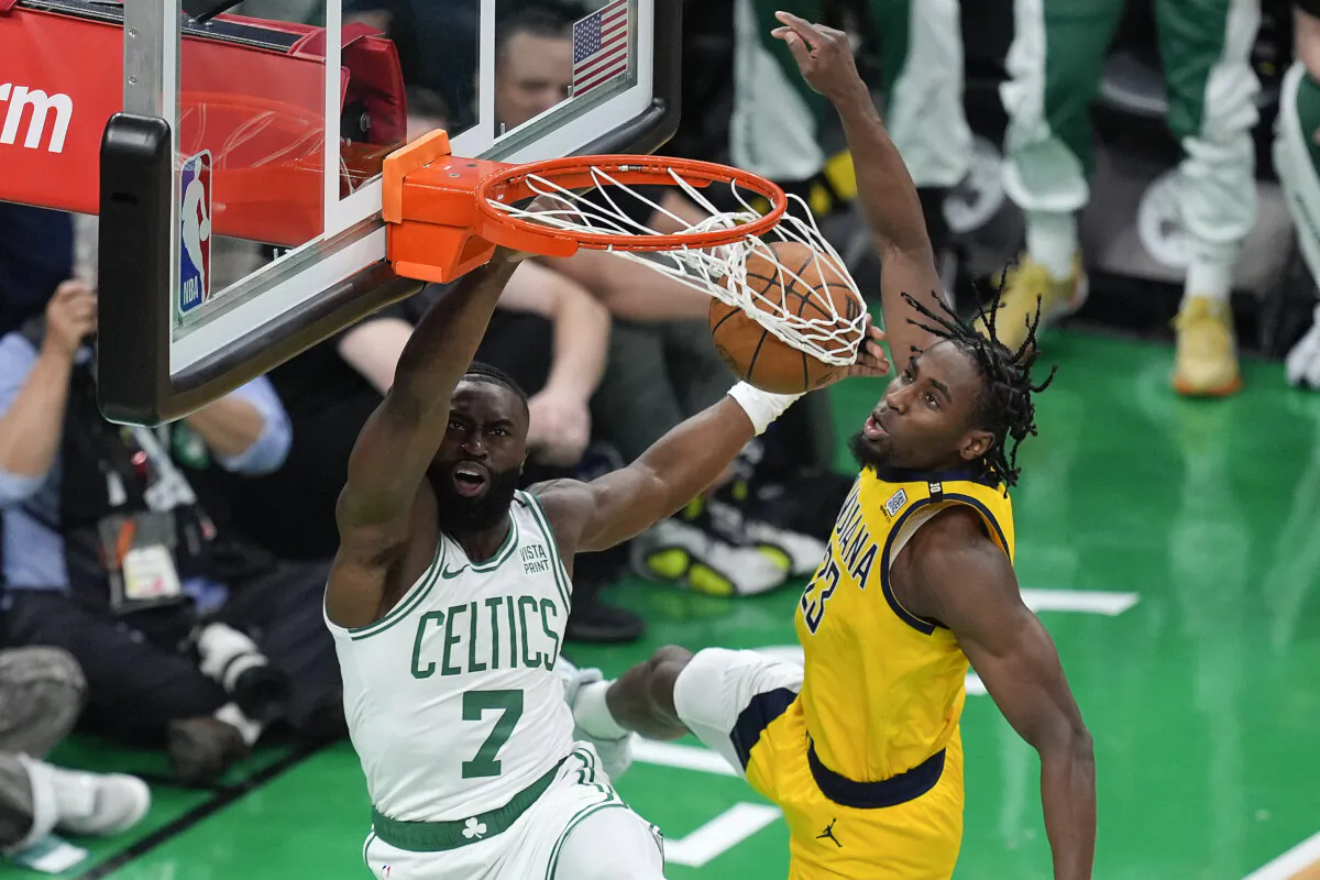 Jaylen Brown of the Boston Celtics dunks against the Indiana Pacers' Aaron Nesmith during Game 1 of the NBA's Eastern Conference finals in Boston on May 21, 2024. (Michael Dwyer/AP Photo)