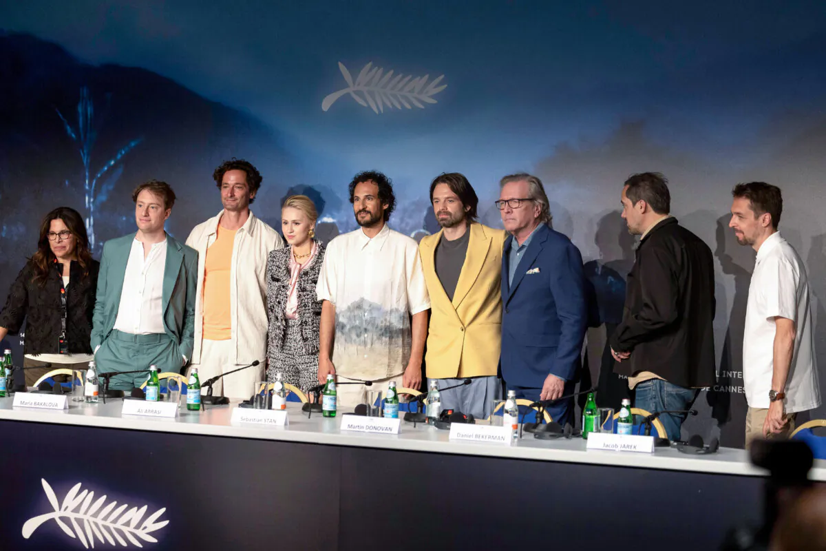 (L–R) Louis Tisné, Amy Baer, Gabriel Sherman, Maria Bakalova, Ali Abbasi, Sebastian Stan, and Martin Donovan attend the "The Apprentice" press conference at the 77th annual Cannes Film Festival at Palais des Festivals in Cannes, France, on May 21, 2024. (Andre Pain-Pool/Getty Images)