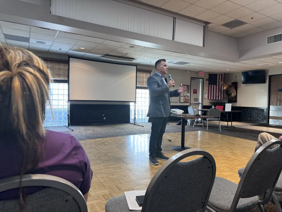 City Attorney Michael Gates updates residents at the Elks Club in Huntington Beach, Calif., on May 20, 2024. (Rudy Blalock/The Epoch Times)

