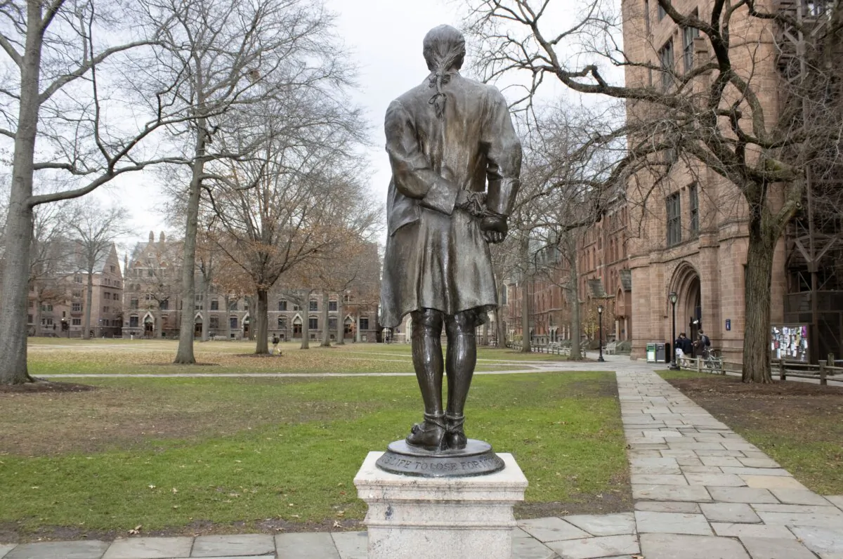 A statue of Nathan Hale, a Yale University class of 1773 graduate, with his hands and ankles bound with rope and the inscription “I only regret that I have but one life to lose for my country” is in front of Hale's former dormitory Connecticut Hall on the college's campus in New Haven, Conn., on Dec. 4, 2023. (Ted Shaffrey/AP Photo)
