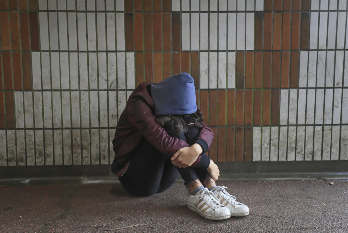 Photo illustration dated January 2020 of a teenage girl showing signs of mental health issues. (PA)