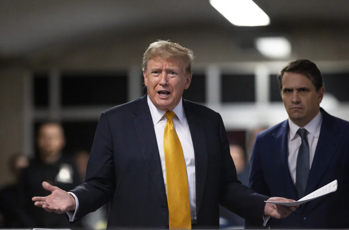 Former President Donald Trump (L) talks to the press while standing with his attorney Todd Blanche (R) at Manhattan Criminal Court in New York City, on May 21, 2024. (Justin Lane/Getty Images)