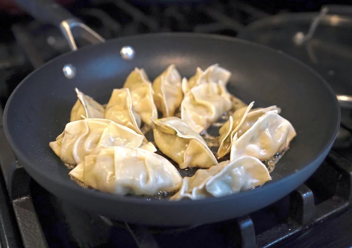 The Post-Gazette’s Gretchen McKay shows the process for making Japanese gyoza, fried dumplings at her home in Ben Avon Friday, April 12, 2024. (Sebastian Foltz/Pittsburgh Post-Gazette/TNS)