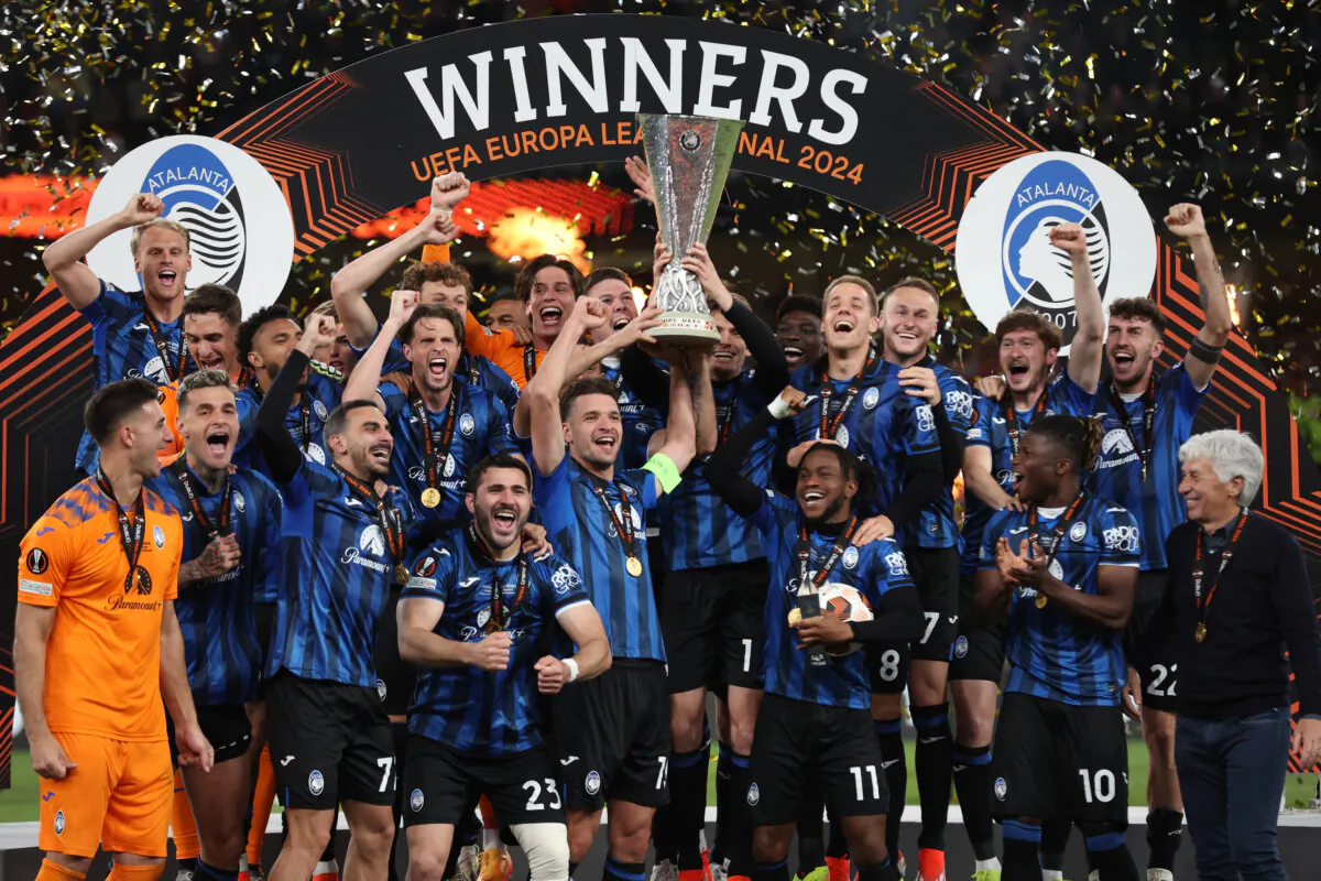 Berat Djimsiti of Atalanta BC lifts the UEFA Europa League Trophy with teammates after their team's victory during the UEFA Europa League 2023/24 final in Dublin, Ireland, on May 22, 2024. (Alex Grimm/Getty Images)