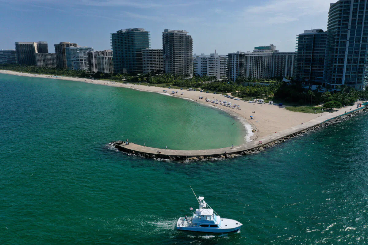 A boat arrives at the Haulover inlet from the Atlantic Ocean to Miami on July 11, 2023. (Joe Raedle/Getty Images)