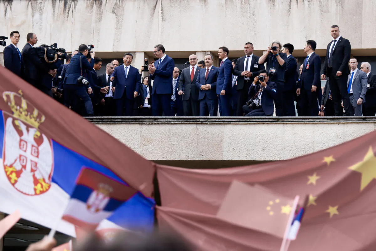 Serbian President Aleksandar Vucic accompanied by Chinese leader Xi Jinping addresses people gathered outside the Palace of Serbia during a welcome ceremony in Belgrade, on May 8, 2024. (STRINGER/AFP via Getty Images)